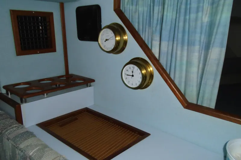 Slide: The Image of Interior of 1989 Sea Ray 300 Weekender with nautical instruments and wooden accents. - 24