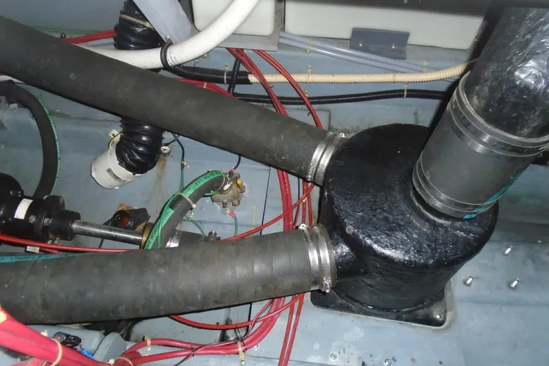 Slide: The Image of Engine compartment of 1989 Sea Ray 300 Weekender with hoses and wiring. - 26