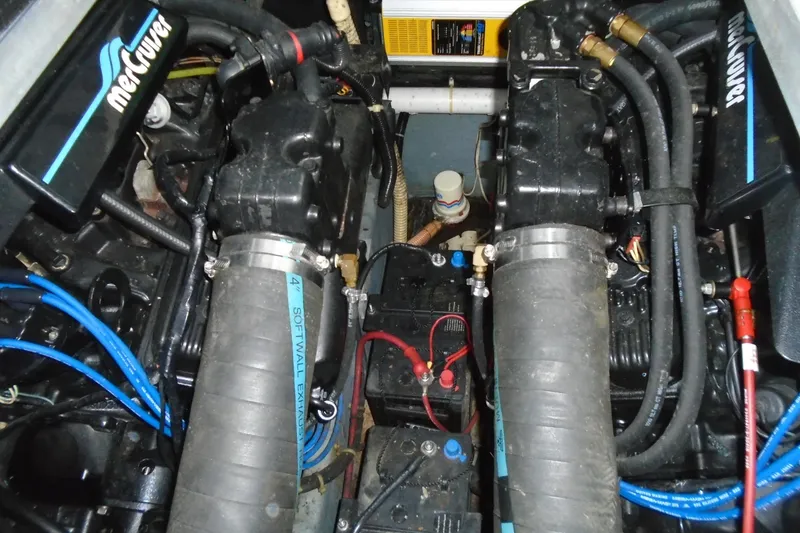 Slide: The Image of Engine compartment of a 1989 Sea Ray 300 Weekender boat, featuring dual MerCruiser engines. - 30