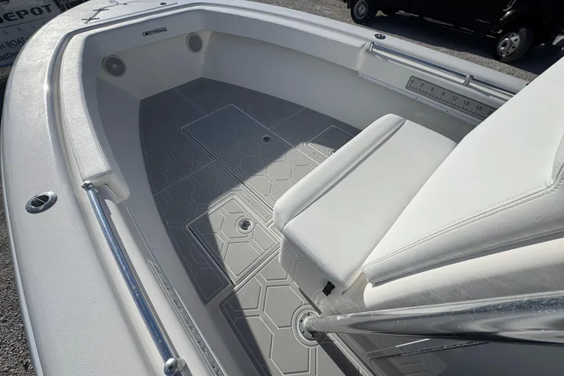 Slide: The Image of 2021 Contender 28 Tournament boat interior with cushioned seating and non-slip flooring. - 7