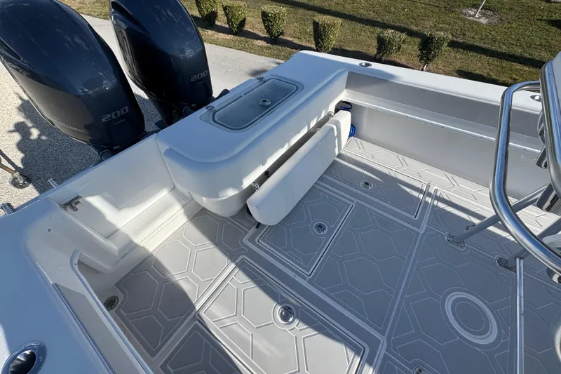 Slide: The Image of 2021 Contender 28 Tournament boat deck with twin 200 engines, featuring sleek design and modern flooring. - 9
