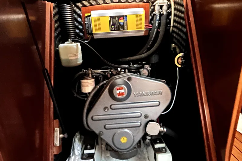 Slide: The Image of Engine compartment of a 2005 Beneteau Oceanis 373 sailboat, featuring a Yanmar engine. - 15