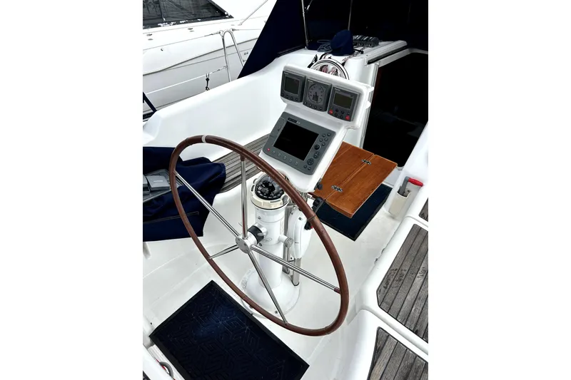 Slide: The Image of Cockpit of 2005 Beneteau Oceanis 373 sailboat with steering wheel and navigation instruments. - 17