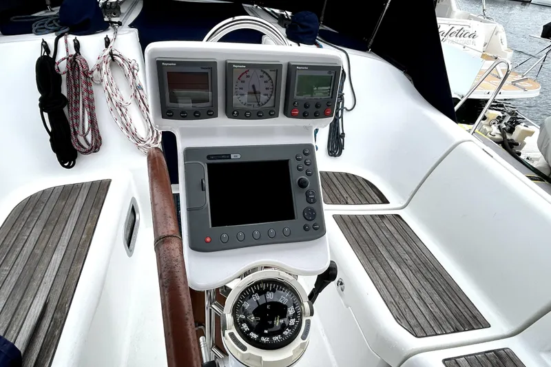 Slide: The Image of Cockpit of 2005 Beneteau Oceanis 373 sailboat with navigation instruments and compass. - 20