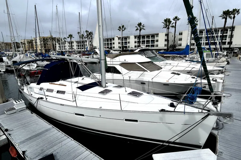 Slide: The Image of 2005 Beneteau Oceanis 373 sailboat docked at a marina with overcast skies. - 5
