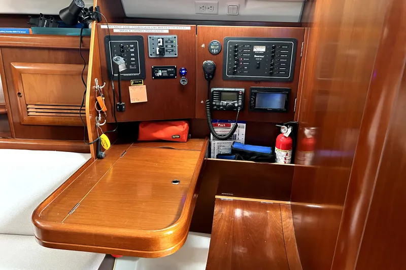 Slide: The Image of Navigation station of 2005 Beneteau Oceanis 373 yacht with control panels and equipment. - 7