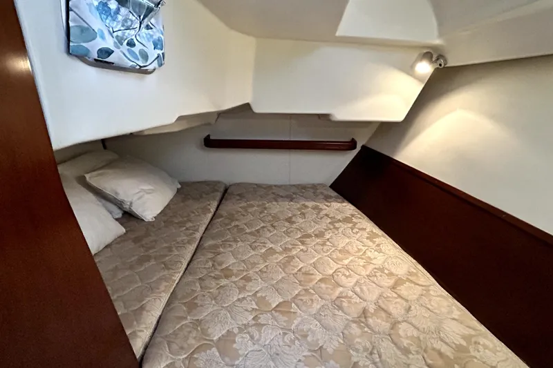 Slide: The Image of Cozy cabin interior of 2005 Beneteau Oceanis 373 sailboat with comfortable bedding. - 9