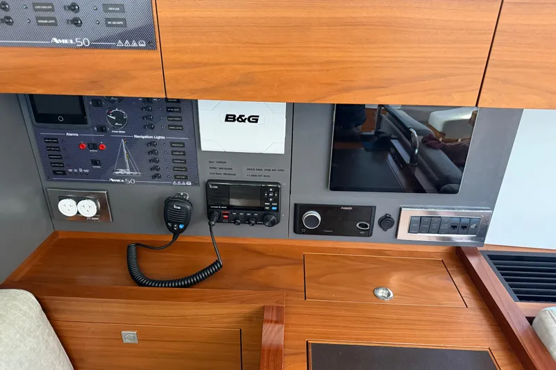 Slide: The Image of Control panel of a 2020 Amel 50 yacht with navigation and communication equipment. - 11
