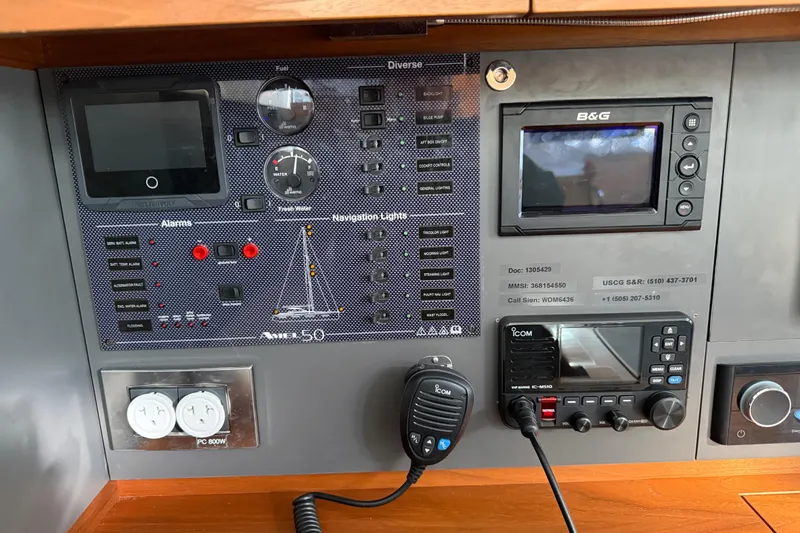 Slide: The Image of Control panel of a 2020 Amel 50 yacht with navigation and communication systems. - 12