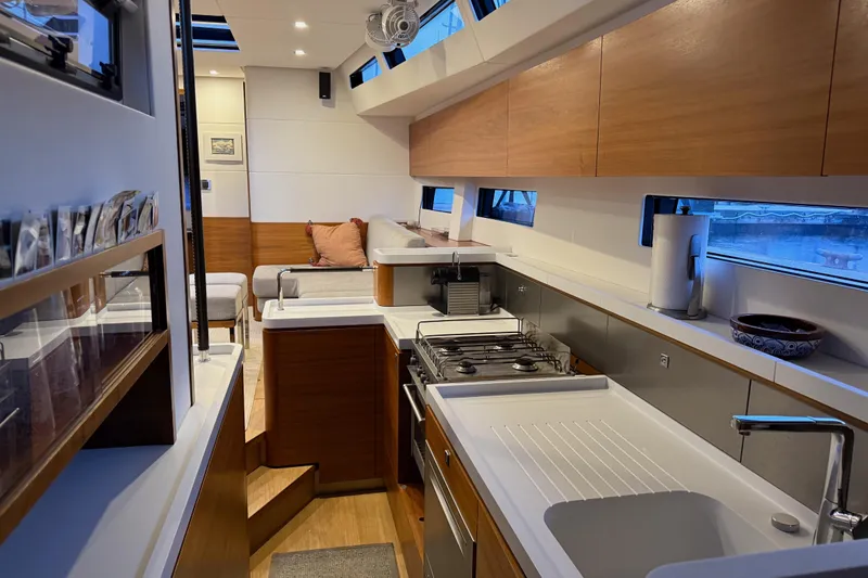 Slide: The Image of Modern interior of 2020 Amel 50 yacht with sleek kitchen and cozy seating area. - 16