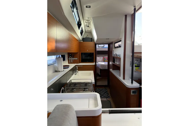 Slide: The Image of Interior of 2020 Amel 50 yacht featuring modern kitchen and cozy bedroom. - 19