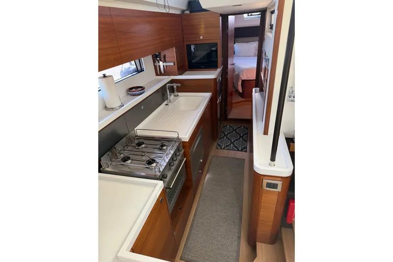 Slide: The Image of Interior of 2020 Amel 50 yacht featuring modern kitchen and cozy bedroom. - 20