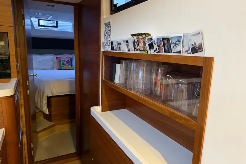 Slide: The Image of Interior of 2020 Amel 50 yacht with cozy bedroom and wooden shelving. - 23