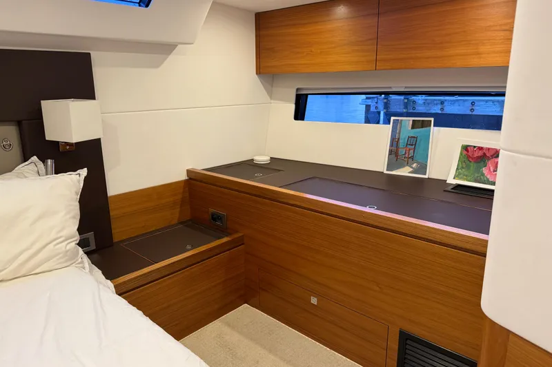 Slide: The Image of Luxurious cabin interior of 2020 Amel 50 yacht with wooden accents and modern decor. - 28