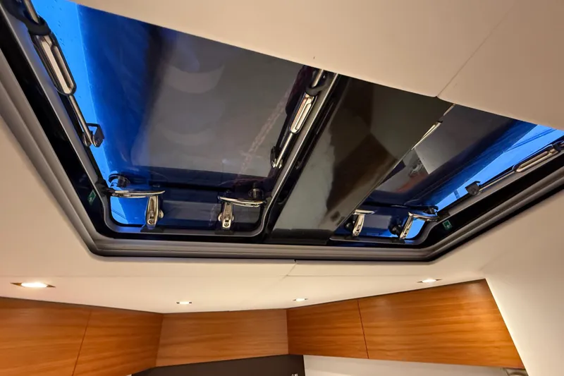 Slide: The Image of Skylight view inside 2020 Amel 50 yacht, showcasing sleek design and modern fixtures. - 31