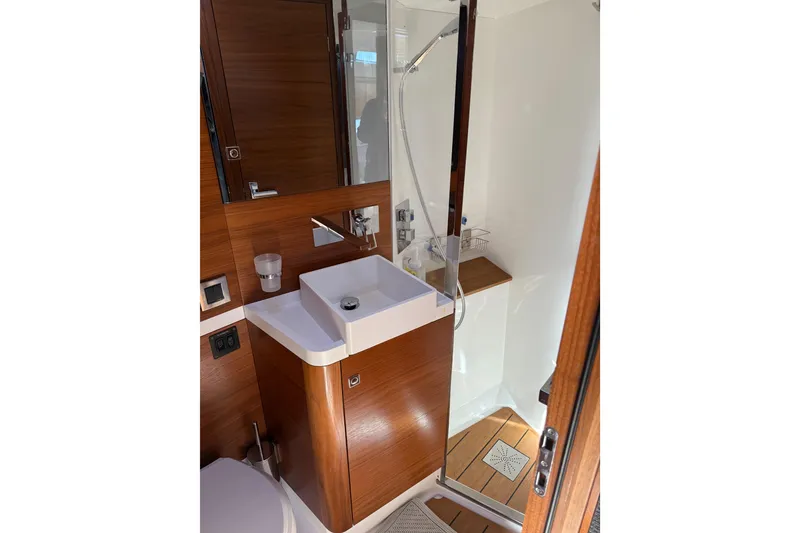 Slide: The Image of Luxurious bathroom in 2020 Amel 50 yacht with modern fixtures and wooden accents. - 32