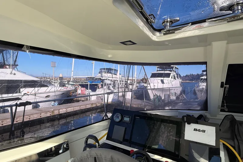 Slide: The Image of Interior view of a 2020 Amel 50 yacht docked at a marina. - 38