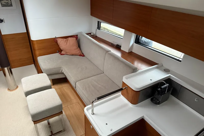 Slide: The Image of Modern interior of 2020 Amel 50 yacht with cozy seating and sleek kitchen area. - 4