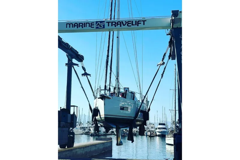 Slide: The Image of 2020 Amel 50 yacht lifted by Marine Travelift at marina. - 48