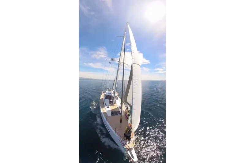 Slide: The Image of Sailing yacht Amel 50, 2020 model, cruising on open sea under clear blue sky. - 49