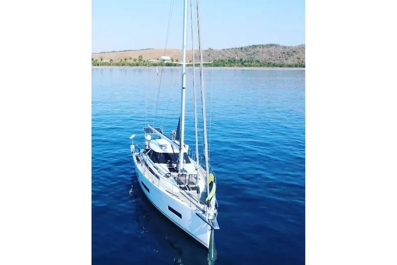 Slide: The Image of Sailing yacht Amel 50, 2020 model, anchored in calm blue waters. - 50