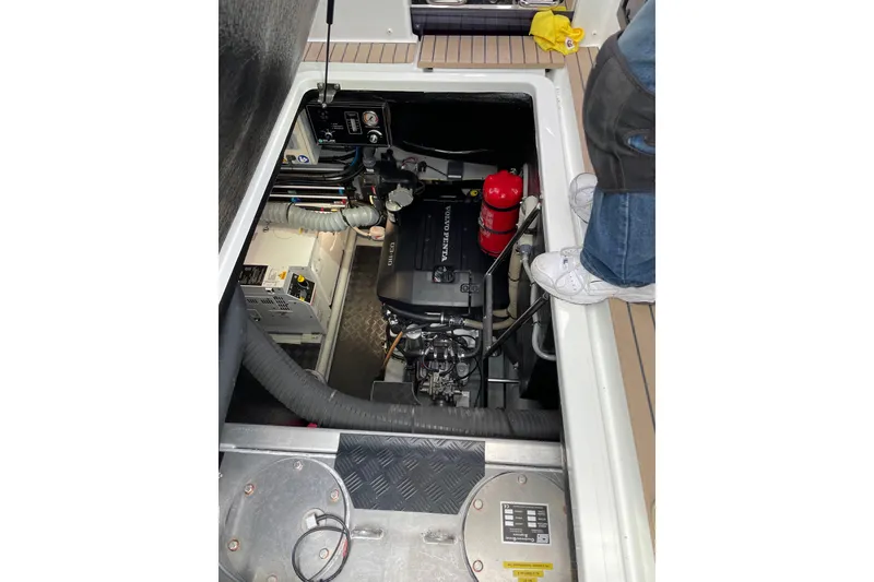 Slide: The Image of Engine compartment of 2020 Amel 50 yacht with Volvo Penta engine visible. - 52