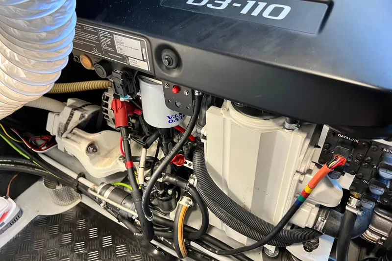 Slide: The Image of Engine compartment of a 2020 Amel 50 yacht, featuring a Volvo Penta D3-110 engine. - 54