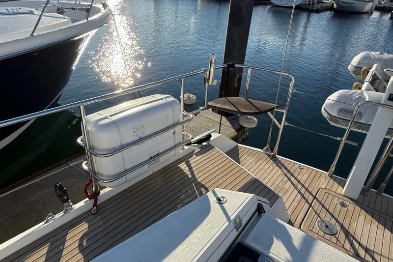 Slide: The Image of Amel 50 yacht deck, 2020 model, with lifeboat and marina view. - 57