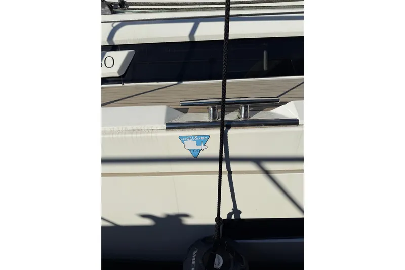 Slide: The Image of Side view of a 2020 Amel 50 yacht with visible cleat and rope. - 64