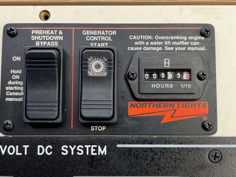 Slide: The Image of Control panel of a 2005 Albin 31 Tournament Express with generator hour meter. - 12