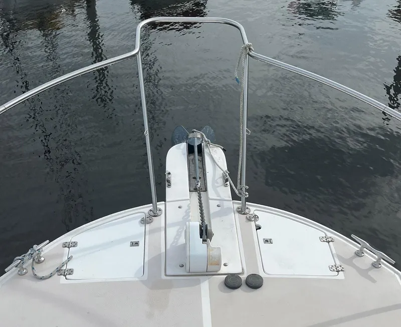 Slide: The Image of Bow view of 2005 Albin 31 Tournament Express boat with anchor and railing. - 2