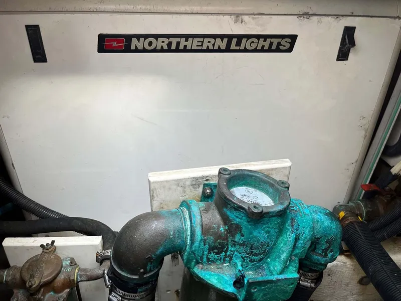 Slide: The Image of Engine compartment of 2005 Albin 31 Tournament Express with Northern Lights generator. - 21