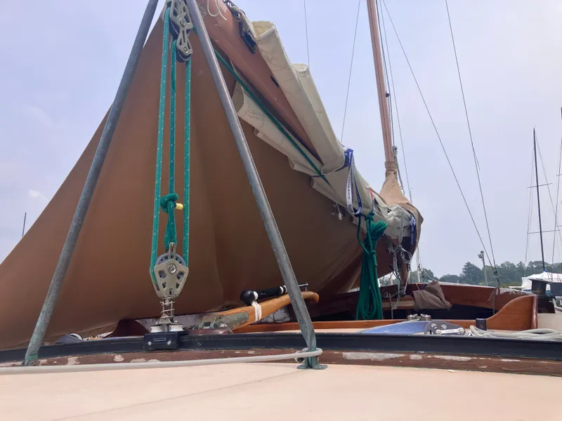 Slide: The Image of 1995 Edey & Duff Stuart Knockabout sailboat with brown sail. - 13