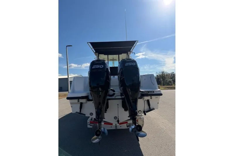 Slide: The Image of 2017 Boston Whaler 285 Conquest with dual 250 horsepower engines, rear view. - 11