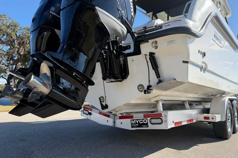 Slide: The Image of 2017 Boston Whaler 285 Conquest on trailer, featuring dual outboard engines. - 13