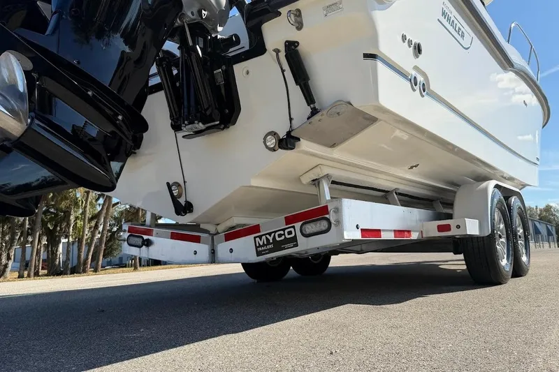 Slide: The Image of 2017 Boston Whaler 285 Conquest on Myco trailer, rear view, parked on road. - 20