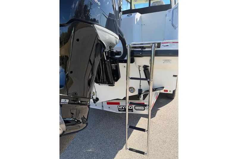 Slide: The Image of 2017 Boston Whaler 285 Conquest boat with ladder and motor detail. - 22