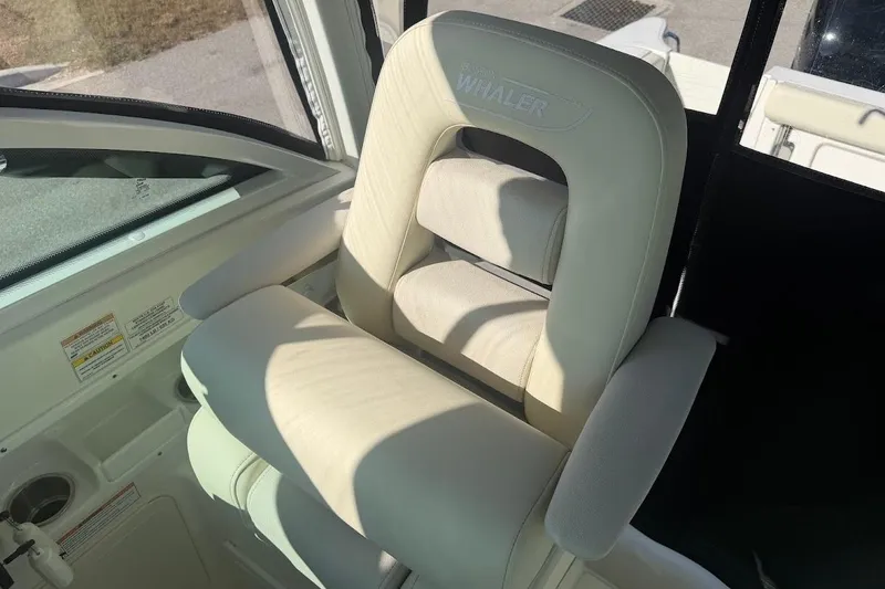 Slide: The Image of 2017 Boston Whaler 285 Conquest boat seat, white upholstery, interior view. - 31