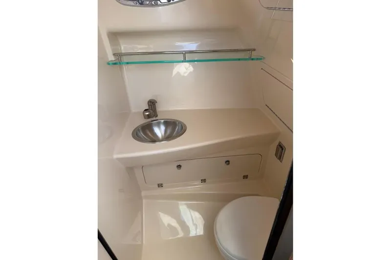 Slide: The Image of 2017 Boston Whaler 285 Conquest bathroom with sink, toilet, and storage. - 41