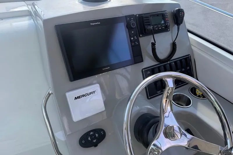 Slide: The Image of Helm of 2017 Boston Whaler 285 Conquest with Raymarine electronics and Mercury controls. - 46