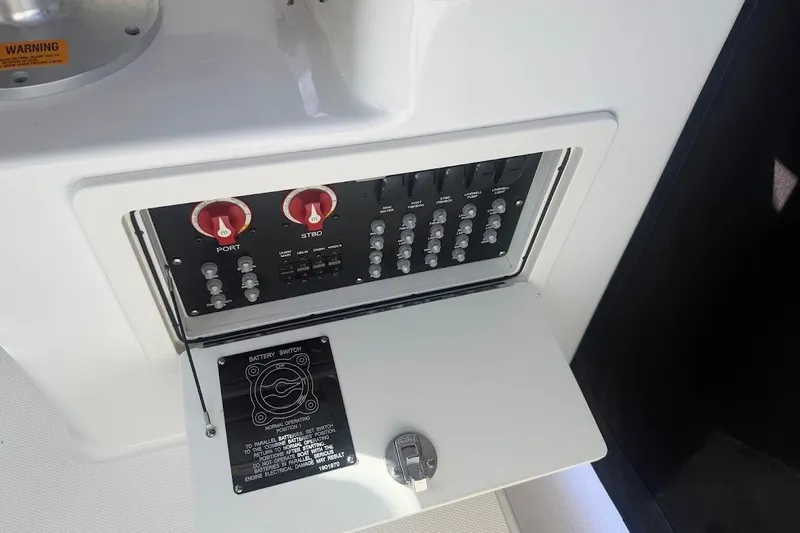Slide: The Image of Control panel of a 2017 Boston Whaler 285 Conquest boat with battery switches. - 47