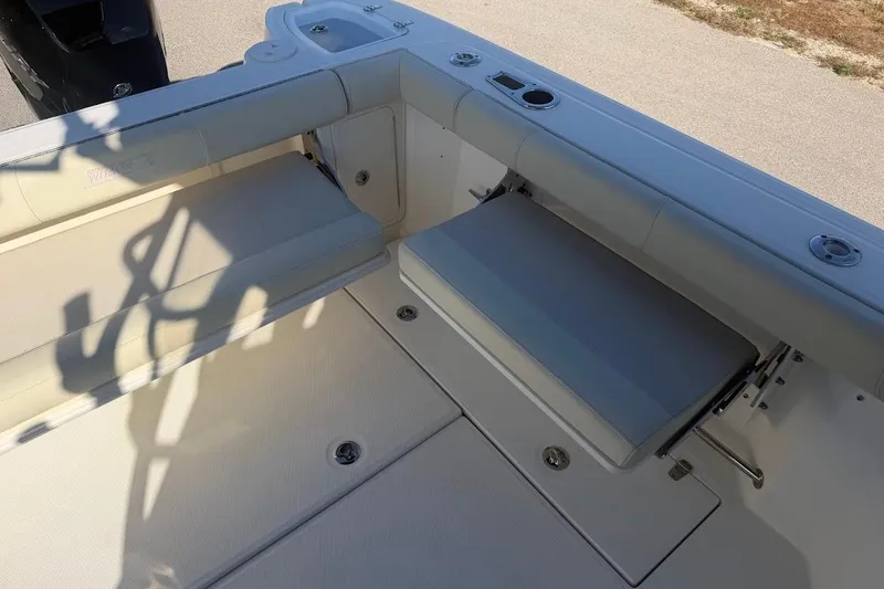 Slide: The Image of 2017 Boston Whaler 285 Conquest boat interior with foldable seating and storage. - 51