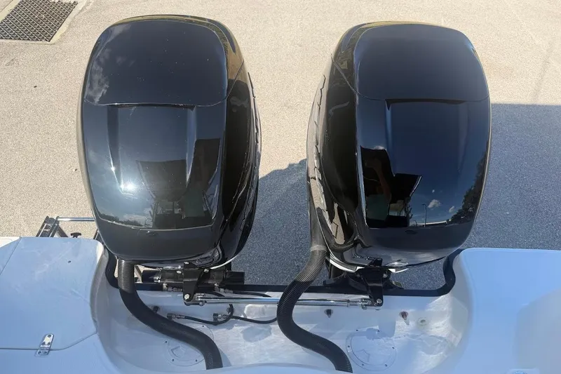 Slide: The Image of Twin outboard engines on a 2017 Boston Whaler 285 Conquest boat. - 56