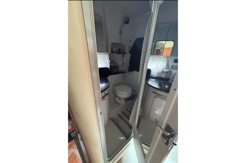 Slide: The Image of 2007 Four Winns 338 Vista boat bathroom interior with shower and toilet. - 20