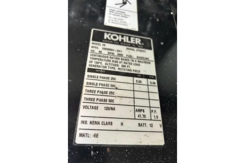Slide: The Image of 2007 Four Winns 338 Vista boat generator label, Kohler specifications, voltage and phase details. - 24