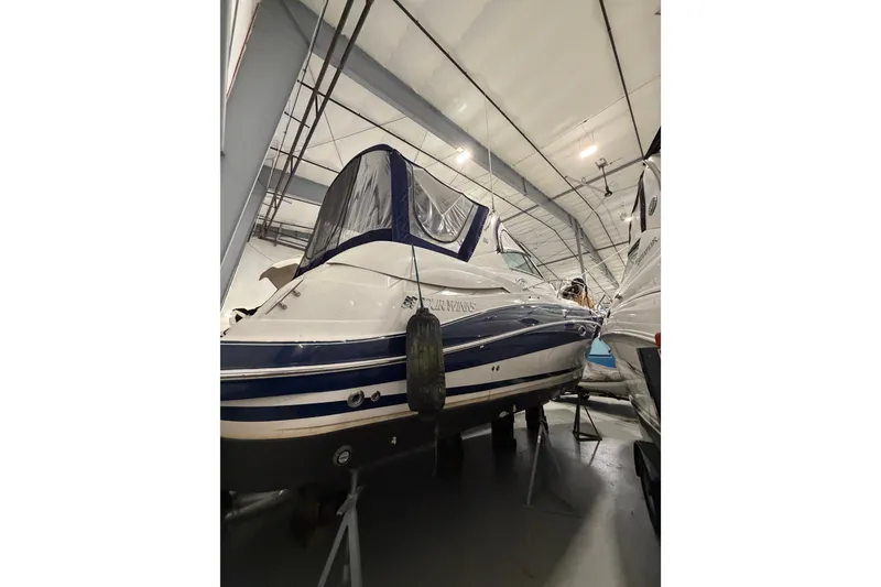 Slide: The Image of 2007 Four Winns 338 Vista boat in indoor storage, side view. - 5