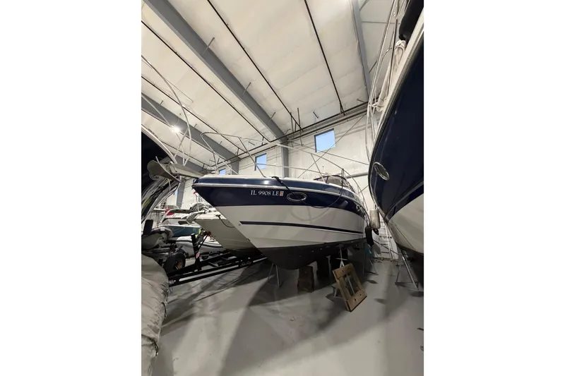 Slide: The Image of 2007 Four Winns 338 Vista boat in indoor storage facility. - 6