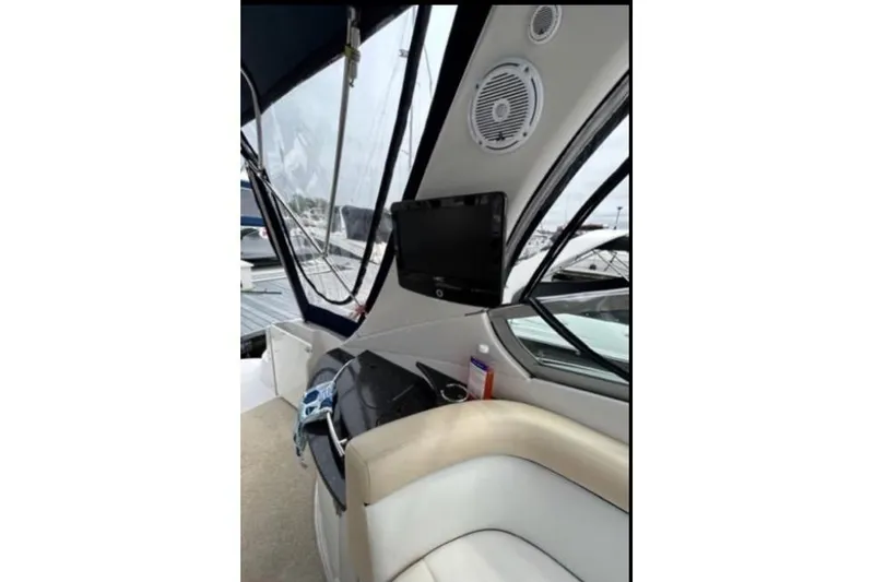 Slide: The Image of Interior view of 2007 Four Winns 338 Vista boat with seating and electronics. - 9