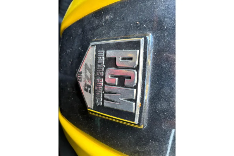 Slide: The Image of Close-up of PCM marine engine badge on 2022 Centurion Ri265. - 13