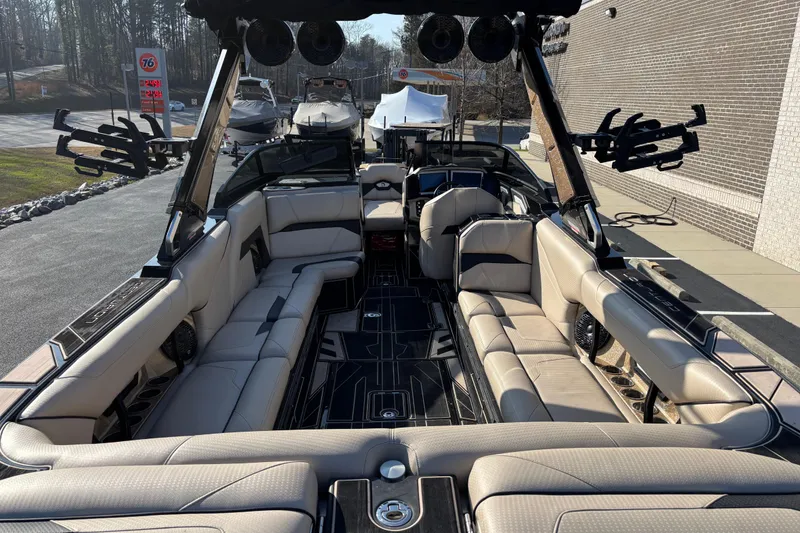 Slide: The Image of 2022 Centurion Ri265 boat interior with luxurious seating and modern design. - 6